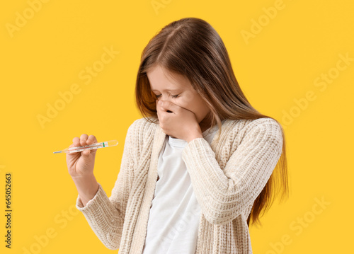 Ill little girl with thermo...