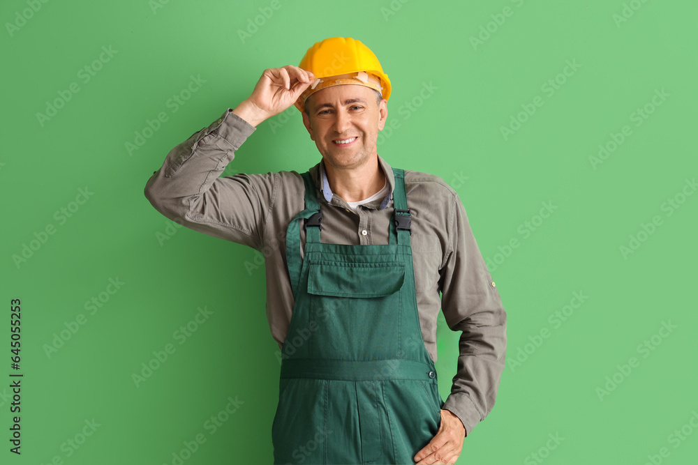 Mature builder on green background Mature builder on green background