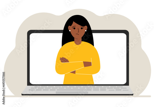 Woman communicates via videoconference through laptop screen. The concept of online meetings, webinars, remote work or work from home.