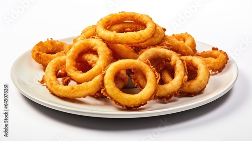 Picture of a plate filled with golden crispy onion rings.