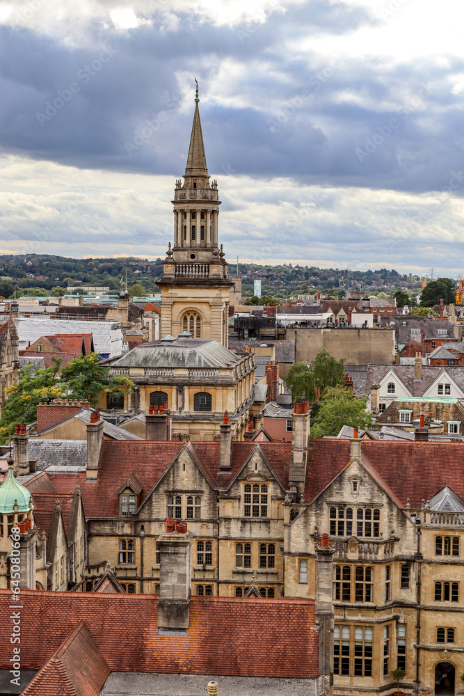 View above the English town Oxford. The historic church tower and the typical old buildings are famous for the town. 