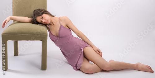 Woman in Lingerie Leaning on Chair
