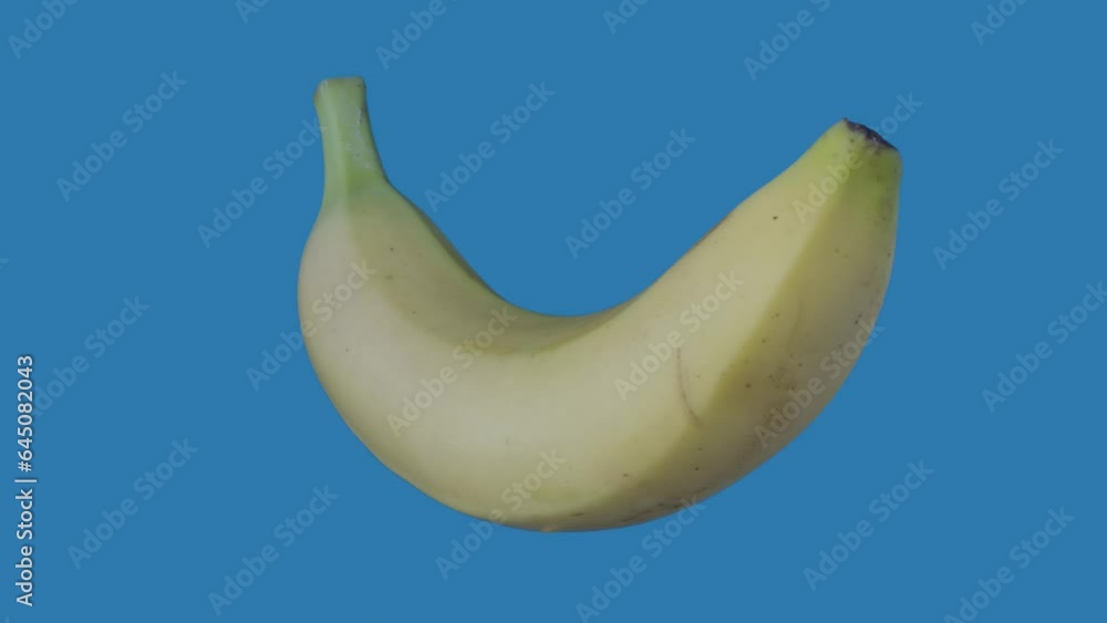Healthy food advertisement creative concept. Closeup shot of banana rotating suspended with all angles visible. Chroma key. Healthy food advertisement creative concept. Closeup shot of banana rotating suspended with all angles visible. Chroma key.