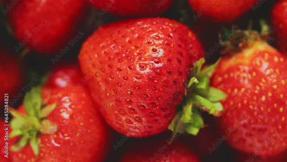 Juicy fresh strawberries rotate in a circle close-up. Slowmotion Juicy fresh strawberries rotate in a circle close-up. Slowmotion