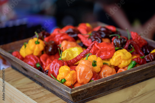 chili peppers on a wooden tray