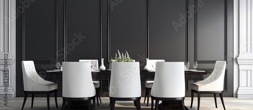 Stampa su tela modern dining room with black chairs, wooden table, and white paneling wall