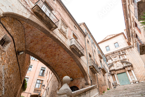 Beautiful steps and archway of the Pujada de Sant Domenec in Girona, Spain photo