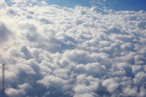 Cumulous clouds seen from the sky. Background wallpaper