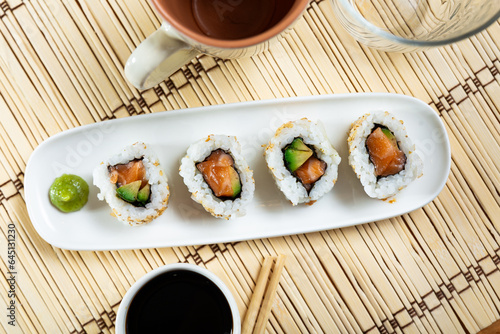 Japanese dish california roll uramaki with salmon and avocado