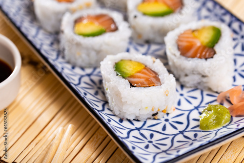 Japanese roll california urumaki with salmon avocado and sesame