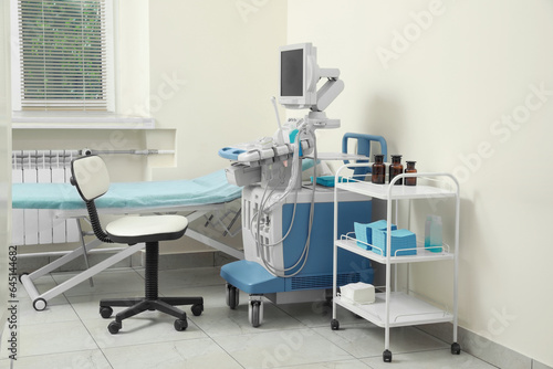 Ultrasound machine  chair  medical trolley and examination table in hospital