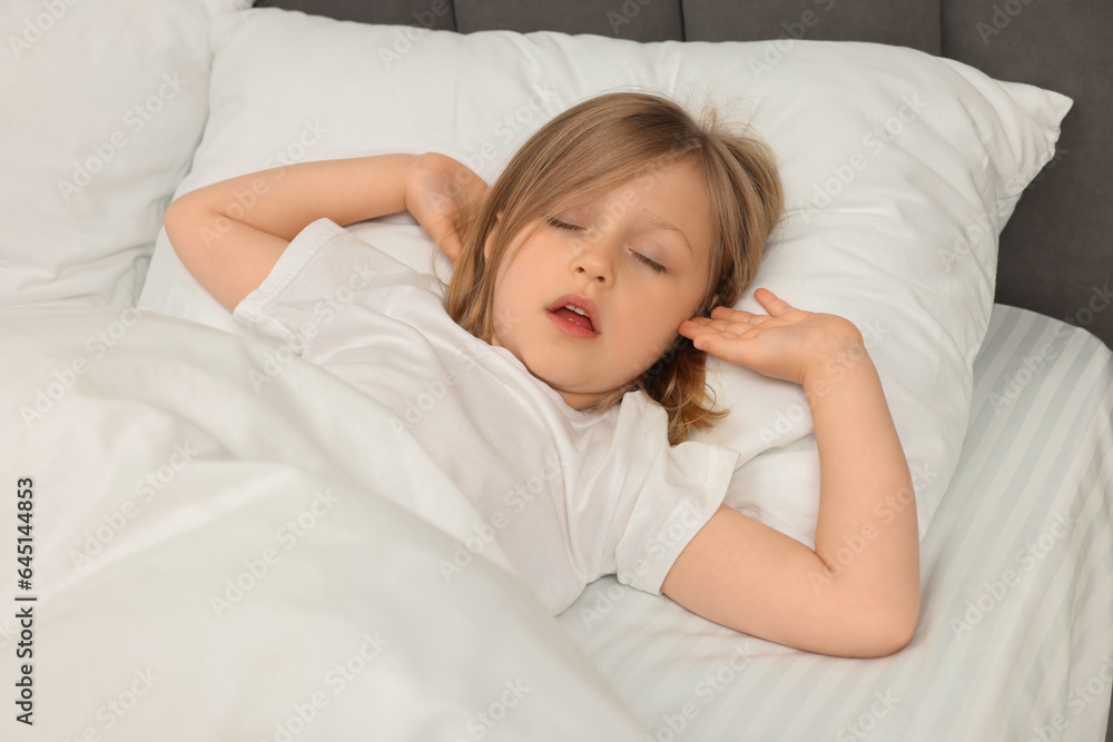 Little girl snoring while sleeping in bed Little girl snoring while sleeping in bed