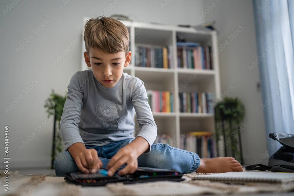 Small boy pupil child prepare his backpack for first day of school Small boy pupil child prepare his backpack for first day of school