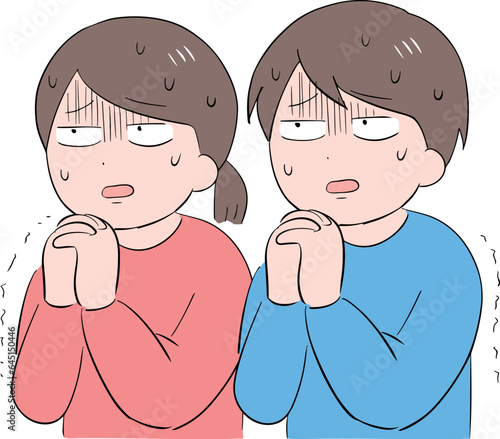不安な表情で祈る男女