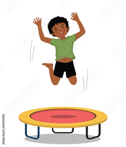Little African boy jumping on a trampoline having fun playing outdoor sport activity