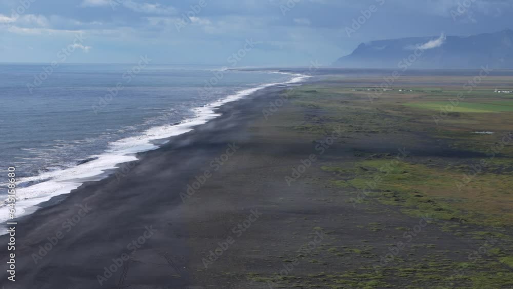 Dyrhólaey Iceland from above during strong winds. Waves and sand movements can be seen Dyrhólaey Iceland from above during strong winds. Waves and sand movements can be seen