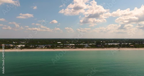Gulf Shore in Florida with houses on the first line and a canal in the background and Drone shot
