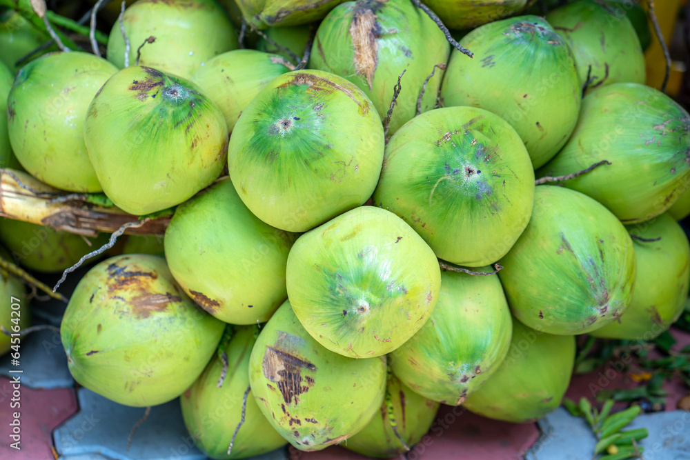 Fresh Coconut cluster for sale at the market, Vietnam fruits, specialties from Ben Tre Fresh Coconut cluster for sale at the market, Vietnam fruits, specialties from Ben Tre