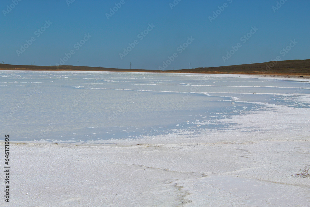 Summer panoramic landscape with small salt lakes and bright blue sky