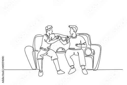 Single continuous line drawing of two young men soccer fans club handshaking and sitting on a couch to watch football match. Happy soccer fans. Dynamic one line draw graphic design vector illustration