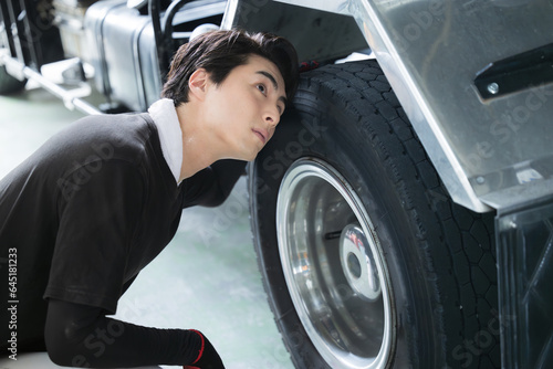 Men working in a factory Automobile mechanics (mechanics), including maintenance of cars, trucks, and tires Profile of manufacturing image