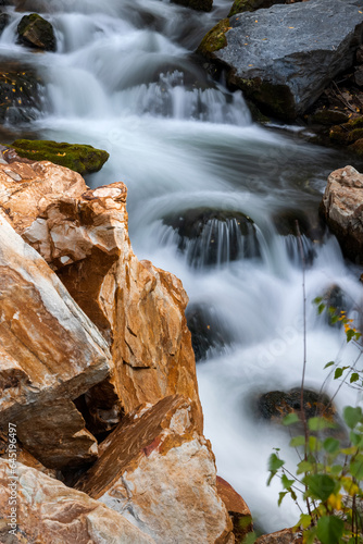 Water falls on Big Cottonwood creek in Utah during autumn time.long exposure.