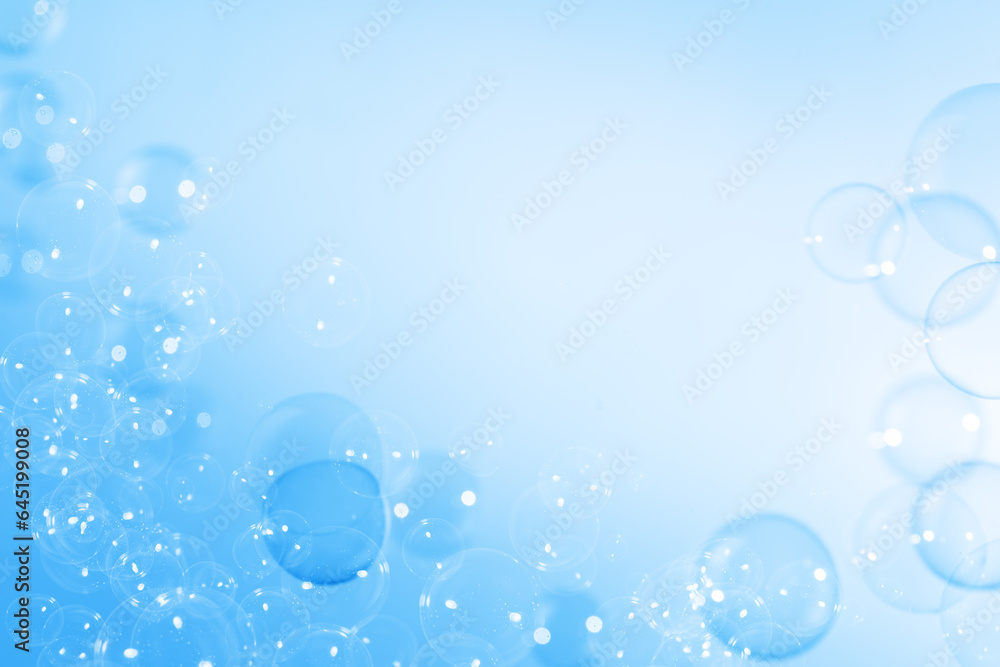 Refreshing of Soap suds, Bubbles Water. Beautiful Transparent Blue Soap Bubbles Floating in The Air. Abstract Blurred Background,  Gradient Blue Textured, Celebration Festive Backdrop.