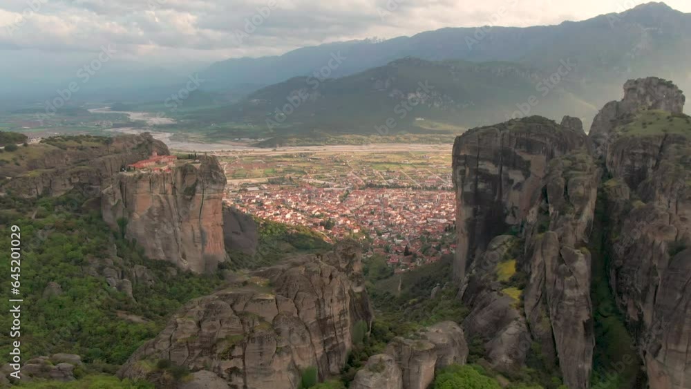 Meteora Travel And Tourism; Drone Approaching Populated Town Of Kalambaka In Thessaly, Greece. Meteora Travel And Tourism; Drone Approaching Populated Town Of Kalambaka In Thessaly, Greece.