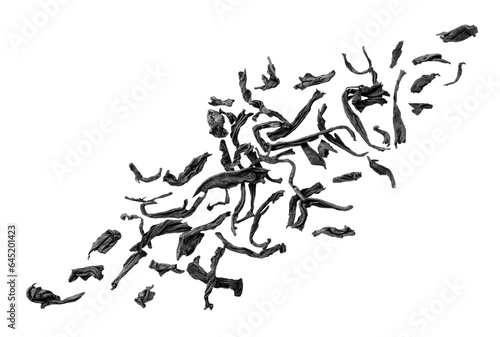 Dried tea leaves flying on a white background. Isolated