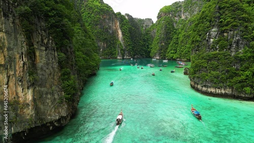 Boats are sailing between the mountains in Pi Leh Bay (Pi Leh Lagoon), Phi Phi Islands, Thailand. Thailand diving trip photo