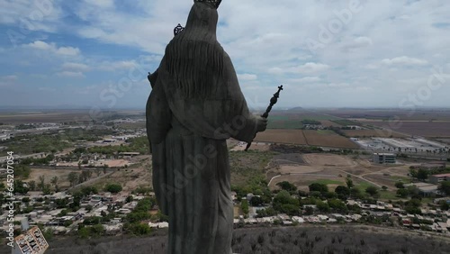 Reveal and aerial view of the Virgen del Valle appreciating the view of the Valle del Fuerte in Los Mochis, Sinaloa, Mexico photo