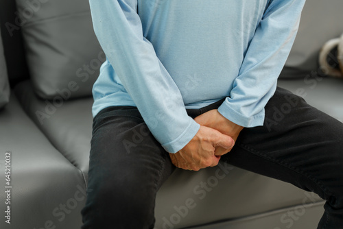 Senior Asian man on the sofa, with sexual dysfunction. Erectile Dysfunction (ED) © makibestphoto