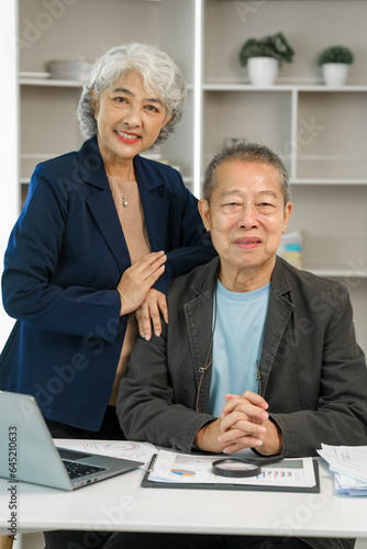 Asian senior man and woman collaborating in small medium enterprises working together. Couple business family, Elderly people