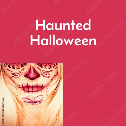 Composite of haunted halloween text and halloween scary face on red background