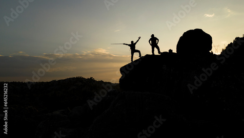 Golden Memories of Happiness at the Top  Two Climbers at Sunset