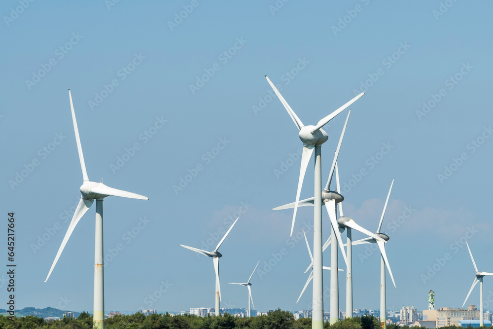 Close-up of wind power systems with a blue sky background on the west coast of Taiwan.