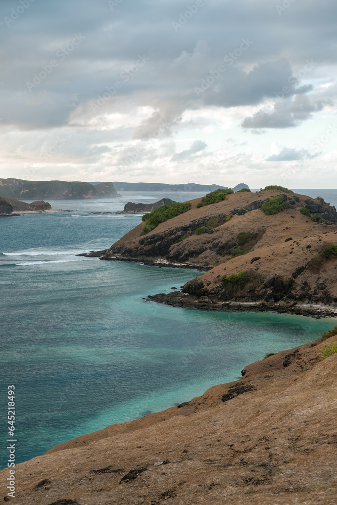 Fototapeta premium incredible views across the coastline at the top of Bukit Merese Hill, Merese Hill is a location to see the sunrise and sunset in Lombok, coast of the sea, beach and sea, view of the, kuta mandalika