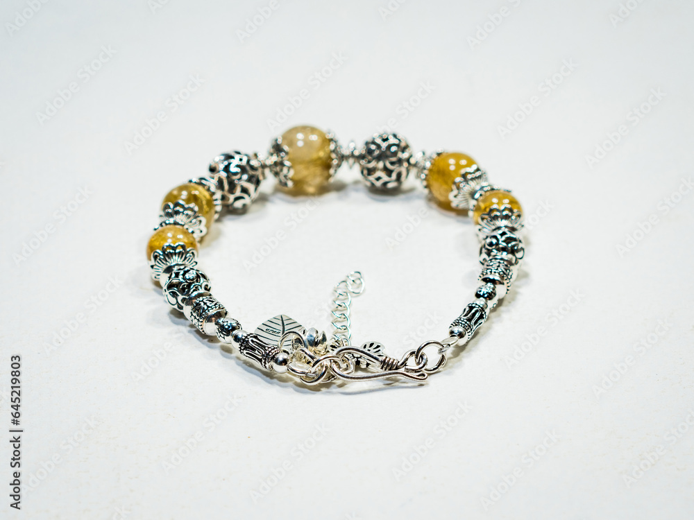 Silver and natural gemstone jewelry on white background Silver and natural gemstone jewelry on white background