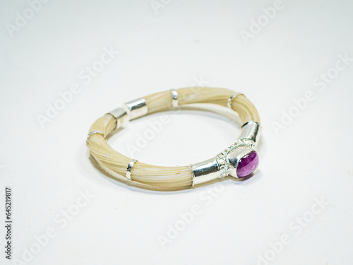 Silver and natural gemstone jewelry on white background