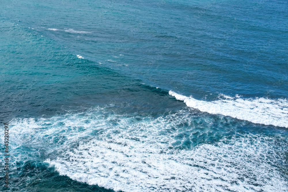 aerial view of waves rolling on the shoreline, blue sea waves, waves crashing on the sea, waves on the sea, waves on the beach, ocean sea water white wave splashing, kuta lombok