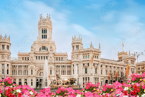 Spain, Madrid - Madrid City Hall building on Cibeles Square, flower garden in the foreground. photo