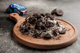 Oreo Pancake served in wooden board isolated on background top view of cafe baked food