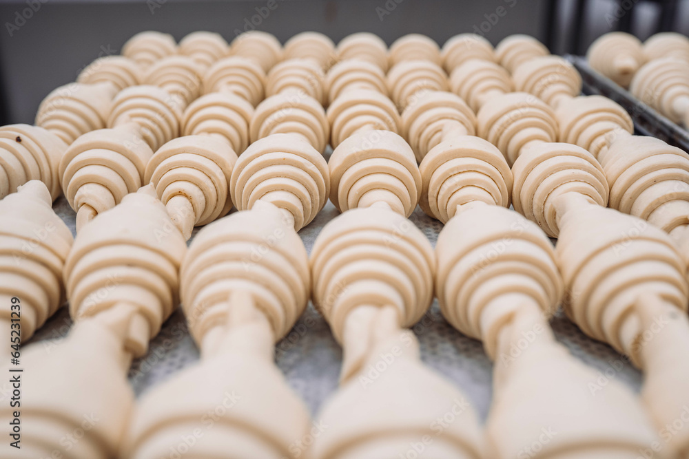 Handmade professional bakery production baker croissant pastry rolling manufacture fresh butter raw measure dough closeup macro plate cut portion Handmade professional bakery production baker croissant pastry rolling manufacture fresh butter raw measure dough closeup macro plate cut portion