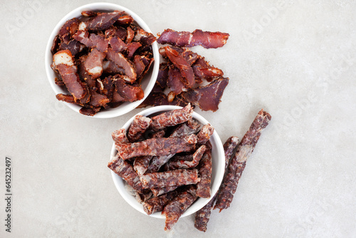 South African Traditional Biltong and dry wors on grey