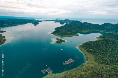 Puncak Mandeh - Aerial View of a blend of natural hills with the beauty of the bay decorated with a group of small islands in the middle of Carocok Tarusan Bay.