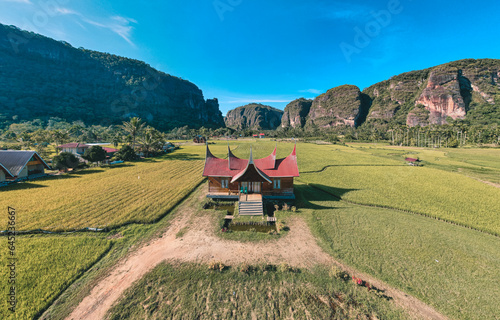 Aerial view Harau Valey or Lembah Harau with Rumah Gadang in the middle of rice field, west sumatra, indonesia photo