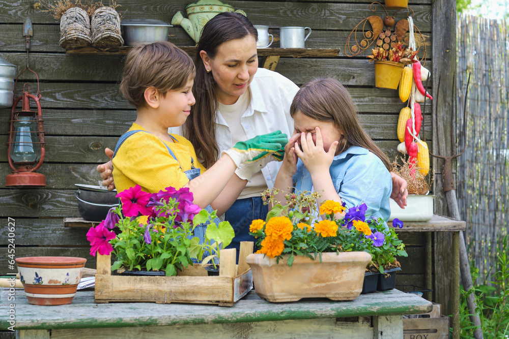 Budding Gardeners: With trowels and laughter, a mom and her children transform their backyard into a lush garden, learning the cycle of life along the way.