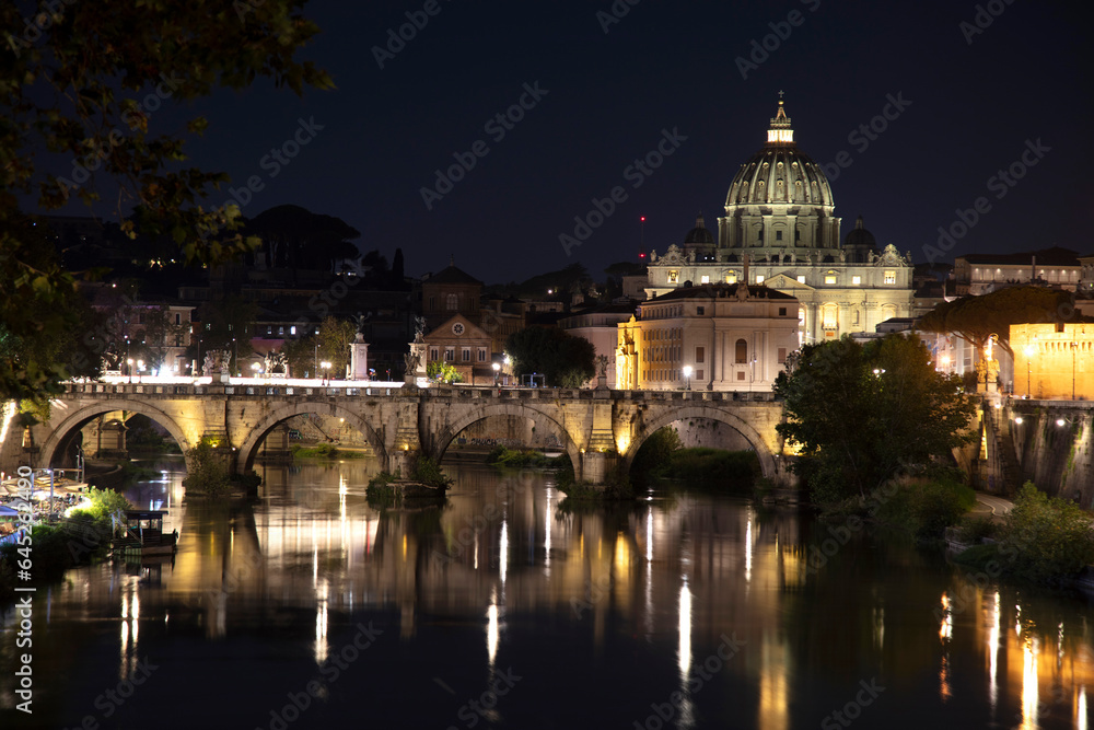 Rome night over Tiber and St Peters Basilica Vatican Italy