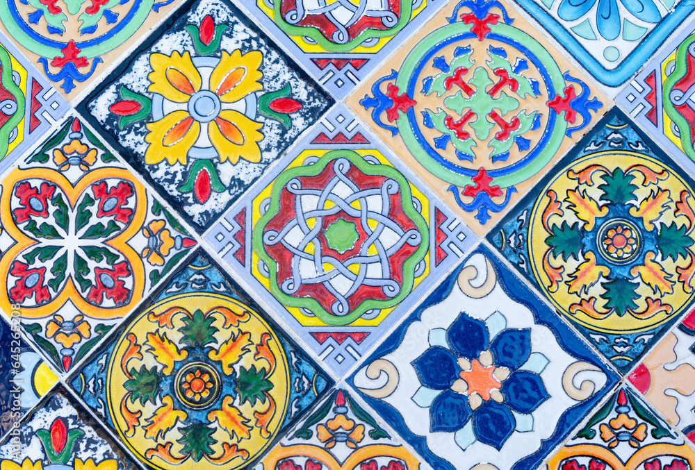 Background from ceramic tiles on the wall with different color decorations