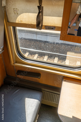 Recumbent seat compartment in the old train Warsaw - Kyiv. View from inside Ukrainian high speed train